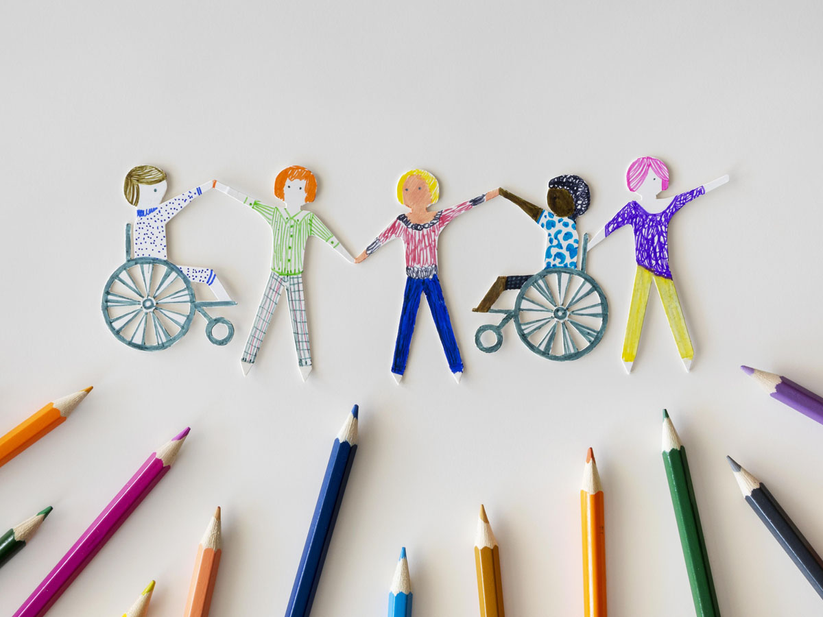 Multi-ethnic and disabled people community with pencils